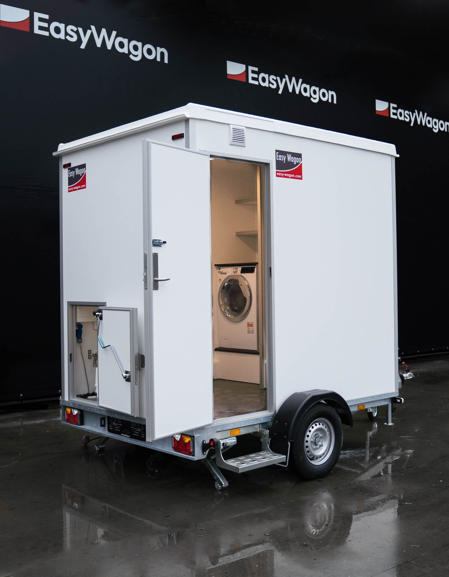 Eight shirts arranged on table in black, olive, grey, blue, white, red, mustard, and green.